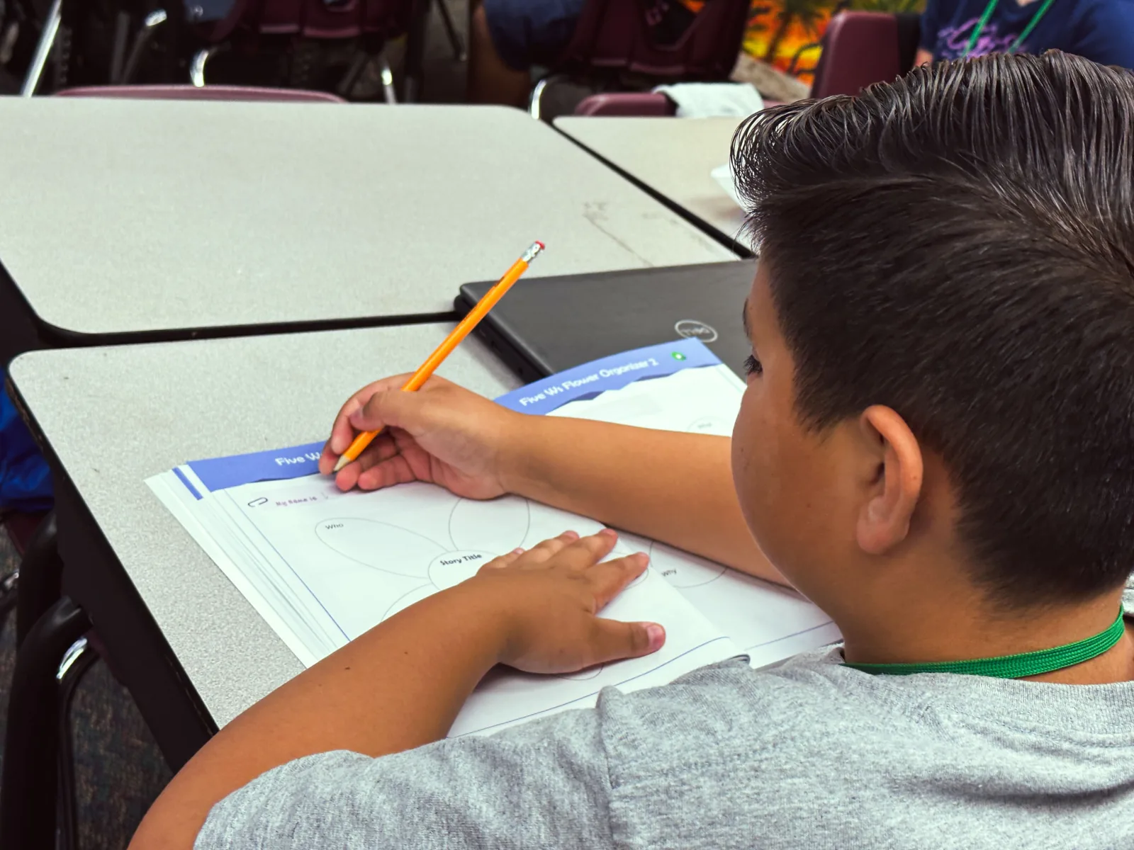 A student writing a reflection after a challenge